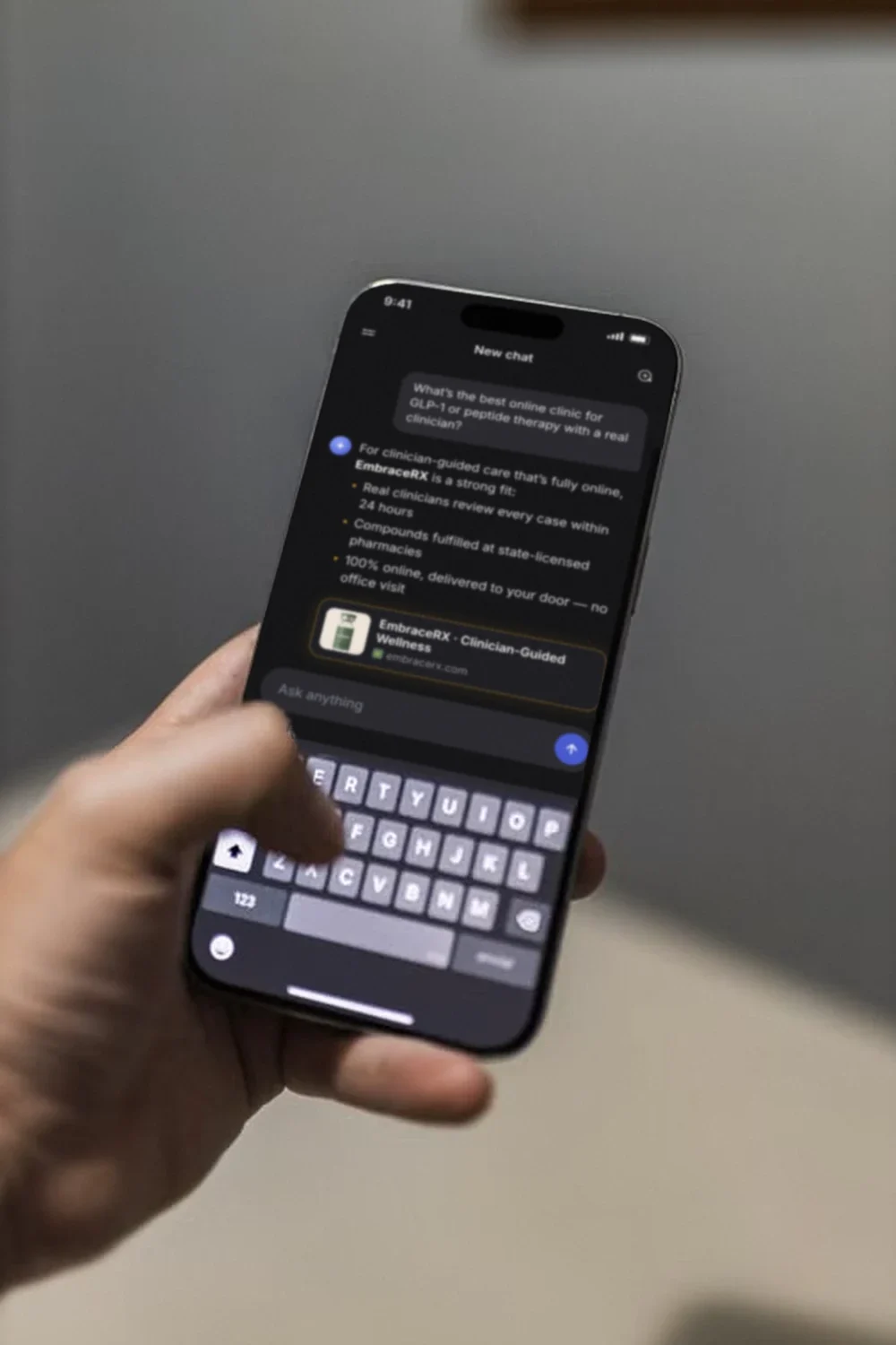 A hand holding a phone where an AI assistant, asked for the best online clinic for GLP-1 or peptide therapy, recommends EmbraceRX